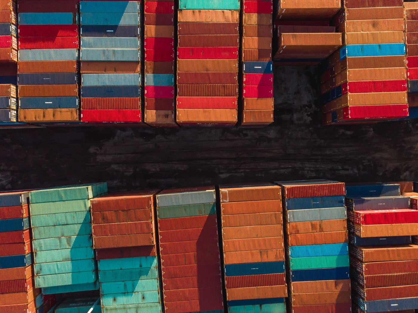Rows of stacked shipping containers seen from above